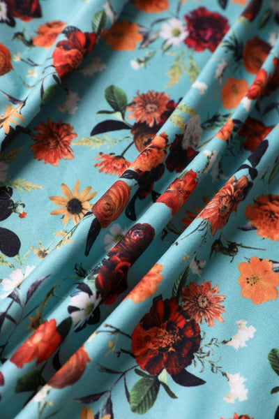 Close up view of Carnation Flowers Tea Dress in Light Blue