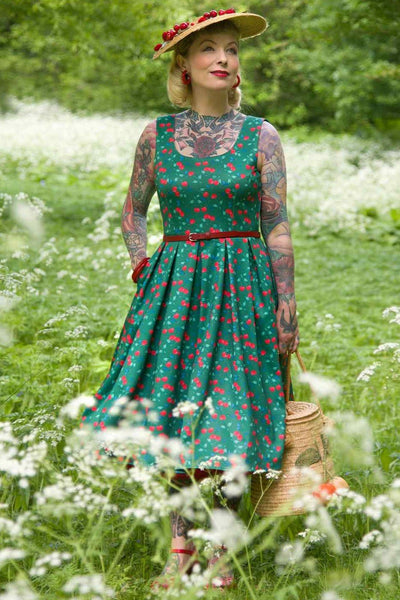 A model wearing a Red Cherry Flared Dress In Green